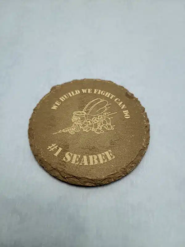 Round Slate Coaster with Seabee Symbol and words We Build, We Fight, Can Do